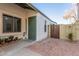 Front entrance with green door and brick walkway at 4044 W Whispering Wind Dr, Glendale, AZ 85310