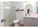 Modern bathroom with a walk-in shower and gray vanity at 428 N Mahogany Ct, Gilbert, AZ 85233