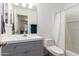 Clean bathroom with gray vanity and white toilet at 428 N Mahogany Ct, Gilbert, AZ 85233