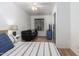 Spacious bedroom with striped bedding and built-in seating at 428 N Mahogany Ct, Gilbert, AZ 85233