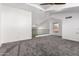 Spacious loft area with gray carpet and high ceilings at 428 N Mahogany Ct, Gilbert, AZ 85233