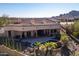 Aerial view of home showcasing a beautiful backyard, including a sparkling pool and lush landscaping at 4361 S Slow Pony Cir, Gold Canyon, AZ 85118