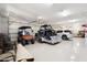 Spacious three-car garage with epoxy floors and plenty of room for parking and storage at 4361 S Slow Pony Cir, Gold Canyon, AZ 85118