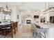 Open floor plan with a fireplace, view of the dining room, and a kitchen island with seating at 4361 S Slow Pony Cir, Gold Canyon, AZ 85118