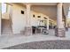 Covered patio featuring stone pillars, and stairs leading to the rooftop terrace at 4361 S Slow Pony Cir, Gold Canyon, AZ 85118