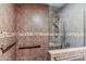 Walk-in shower with tiled walls and grab bars at 4809 N 78Th Pl, Scottsdale, AZ 85251