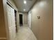 Home hallway with tile flooring and linen closet at 4830 S 22Nd Pl, Phoenix, AZ 85040