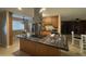 Kitchen with island, granite countertops and stainless steel appliances at 4830 S 22Nd Pl, Phoenix, AZ 85040