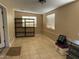 Laundry area with tile flooring and shelving for storage at 4830 S 22Nd Pl, Phoenix, AZ 85040