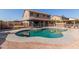 Relaxing kidney-shaped pool, diving board, and backyard oasis at 497 N Superstition Blvd, Chandler, AZ 85225