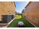 Landscaped backyard with artificial turf and cornhole game at 6025 E Palomino Ln, Scottsdale, AZ 85266