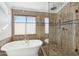 Bathroom with walk-in shower, soaking tub and tile at 6025 E Palomino Ln, Scottsdale, AZ 85266
