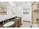 Bathroom boasts double vanity and tile shower at 6025 E Palomino Ln, Scottsdale, AZ 85266