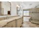 Spa-like bathroom with soaking tub, double vanity and walk-in shower at 6025 E Palomino Ln, Scottsdale, AZ 85266
