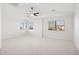 Large bedroom with vaulted ceilings, two windows and ceiling fan at 6025 E Palomino Ln, Scottsdale, AZ 85266