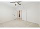 Spacious bedroom with wood-look floors and access to hallway at 6025 E Palomino Ln, Scottsdale, AZ 85266