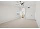 Main bedroom with ceiling fan and access to en-suite bathroom at 6025 E Palomino Ln, Scottsdale, AZ 85266