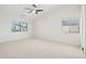 Large bedroom with ceiling fan and window coverings at 6025 E Palomino Ln, Scottsdale, AZ 85266