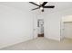 Bright bedroom with ceiling fan and closet access at 6025 E Palomino Ln, Scottsdale, AZ 85266