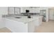 Modern kitchen with white cabinets and quartz countertops at 6025 E Palomino Ln, Scottsdale, AZ 85266