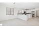 Modern kitchen with white cabinets and a large island at 6025 E Palomino Ln, Scottsdale, AZ 85266