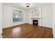 Bright living room with hardwood floors and a marble fireplace at 6025 E Palomino Ln, Scottsdale, AZ 85266