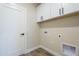 Bright laundry room with white cabinets and vinyl flooring at 6128 S Sage Way, Gold Canyon, AZ 85118