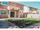 House with grassy backyard, patio, and block wall at 7 N 87Th Dr, Tolleson, AZ 85353