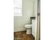 Clean bathroom with toilet, vanity, and tiled floor at 7 N 87Th Dr, Tolleson, AZ 85353