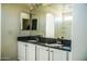 Double vanity bathroom with granite countertop at 7 N 87Th Dr, Tolleson, AZ 85353