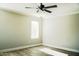Bright bedroom with wood-look floors and ceiling fan at 7 N 87Th Dr, Tolleson, AZ 85353