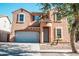 Two-story house with a large garage and desert landscaping at 7 N 87Th Dr, Tolleson, AZ 85353