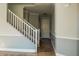 Hallway with staircase and tile flooring at 7 N 87Th Dr, Tolleson, AZ 85353