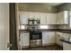 Modern kitchen with stainless steel appliances and granite countertops at 7 N 87Th Dr, Tolleson, AZ 85353