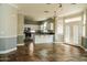 Kitchen with island, stainless steel appliances, and white cabinets at 7 N 87Th Dr, Tolleson, AZ 85353
