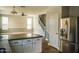 Island kitchen with stainless steel appliances and granite countertops at 7 N 87Th Dr, Tolleson, AZ 85353