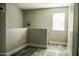 Upstairs hallway with wood-look flooring and a window at 7 N 87Th Dr, Tolleson, AZ 85353