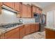 Kitchen with stainless steel appliances and wood cabinets at 7278 E La Junta Rd, Scottsdale, AZ 85255