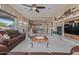 Open living room with a fireplace, comfortable seating, and views of the kitchen at 7278 E La Junta Rd, Scottsdale, AZ 85255