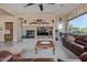 Spacious living room with fireplace, comfortable seating, and large windows offering natural light at 7278 E La Junta Rd, Scottsdale, AZ 85255