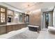 Spacious bathroom with a large soaking tub, dual vanities, and walk-in shower at 8124 E Paraiso Dr, Scottsdale, AZ 85255