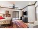 Bright bedroom with a plush carpet, comfortable seating and plenty of natural light at 8124 E Paraiso Dr, Scottsdale, AZ 85255