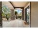 Elegant entryway with stone pillars and arched doorways at 8124 E Paraiso Dr, Scottsdale, AZ 85255