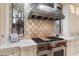 Luxury kitchen with professional range and custom cabinetry at 8124 E Paraiso Dr, Scottsdale, AZ 85255
