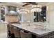 Modern kitchen with large island and breakfast bar seating at 8124 E Paraiso Dr, Scottsdale, AZ 85255
