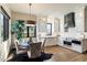 Modern kitchen with white cabinets, breakfast nook, and stainless steel appliances at 8124 E Paraiso Dr, Scottsdale, AZ 85255