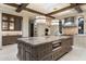 Gourmet kitchen with large island, high-end appliances, and wood beams at 8124 E Paraiso Dr, Scottsdale, AZ 85255