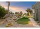Desert landscaping with putting green and pathways at 8124 E Paraiso Dr, Scottsdale, AZ 85255