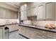 Bright laundry room with custom cabinetry and spacious countertop at 8124 E Paraiso Dr, Scottsdale, AZ 85255