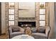 Elegant living room features a fireplace, built-in shelving, and comfortable seating at 8124 E Paraiso Dr, Scottsdale, AZ 85255
